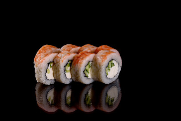 Fresh delicious beautiful sushi rolls on a dark background