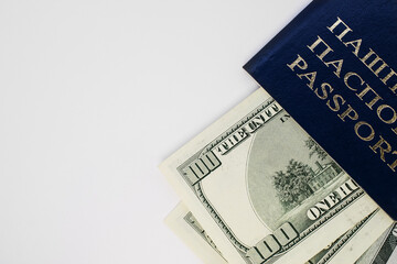 Belarusian passport on a white background with a space for the text. dollar bills are inside the passport.