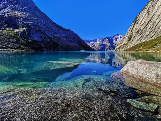 Gelmersee. Dam in the Swiss alps for Hydro power. Clear Blue lake
