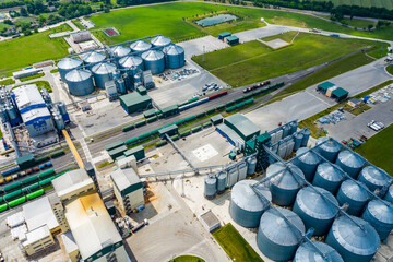 Production of sustainable fuel called bio gas. New factory in field. View from above. Ecological...