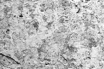 Texture of a concrete wall with cracks and scratches which can be used as a background