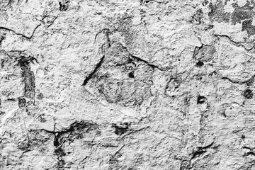 Fototapeta premium Texture of a concrete wall with cracks and scratches which can be used as a background