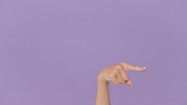 Close up cropped woman hand pointing at different directions showing thumbs up gesture like sign isolated on pastel purple violet background in studio. Copy space Advertising area workspace mock up