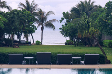 beach beds at seaside pool in the resort somewhere in Thailand