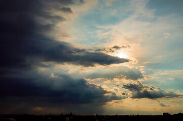 sun shining after big dark cloud pass