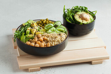 Healthy vegetable lunch from the Buddha bowl with quinoa, avocado, chickpeas. healthy food dish for vegetarians.
