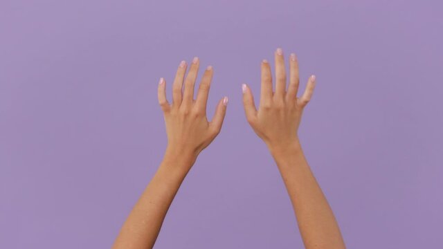 Close up cropped two woman hands touch something like push click on button pointing at floating virtual screen typing on vr keyboard gesture isolated on violet background in studio. Copy space mock up