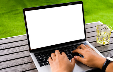Businesswoman hand using laptop computer mockup white background on desk at coffee cafe. computer with blank screen.