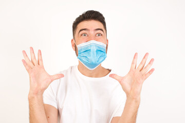 Screaming, hate, rage. Crying emotional angry man screaming on blue studio background. Emotional, young face. Female half-length portrait. Human emotions, facial expression concept. Trendy colors