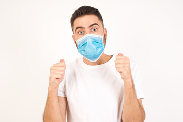 Human face expressions and emotions. Portrait of young desperate man looking panic, holding his hands near his face, with mouth wide open. Male in despair and shock