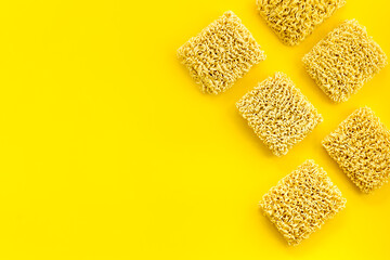 Instant noodle on Yellow background top view copy space mockup