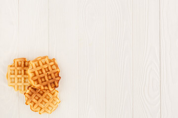 belgian waffles on wooden background top view mockup