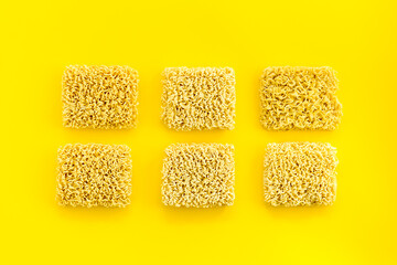 Instant noodle on Yellow background top view copy space mockup
