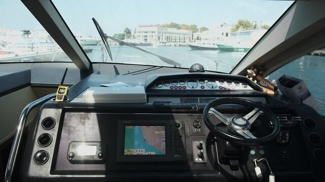 yacht with instruments and steering wheel the hands of the captain. Close up. speedboat or luxury yacht ship. navigation. man steering
