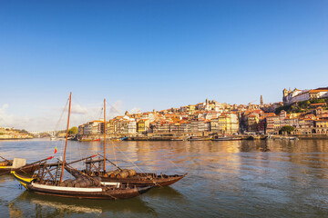 Porto Portugal city skyline at Porto Ribeira and Douro River with Rabelo wine boat