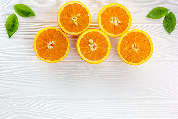 Orange slices on the on white table wooden background top view flat lay copy space