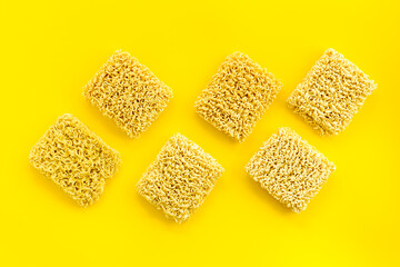 Instant noodle on Yellow background top view copy space mockup