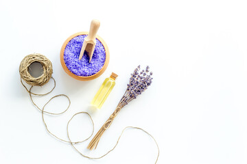 Lavender spa set. Violet bath salt and essence oil on white background