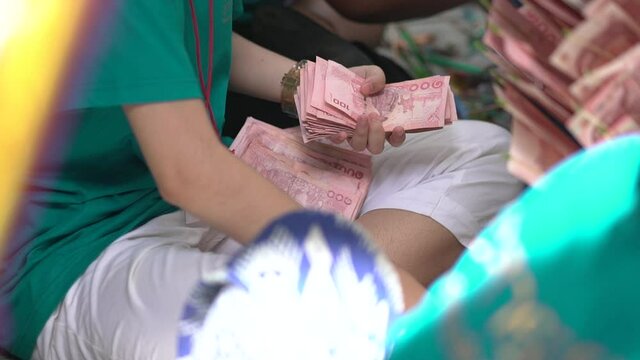A group of women counting money