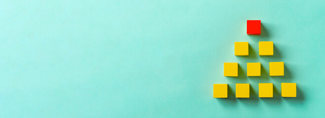 Business material, pyramid-shaped block. Society, organization, strategy, top-down, plans, ideas,...