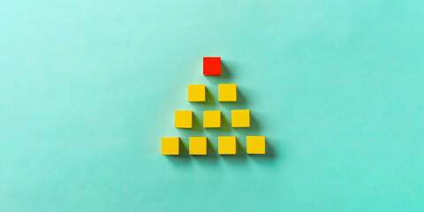 Business material, pyramid-shaped block. Society, organization, strategy, top-down, plans, ideas,...