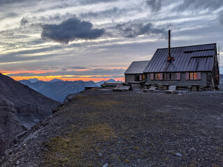 Hut Hike in the Swiss Alps with a sunset or sunrise
