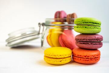 Delicious colorful macarons close-up. Food background, side view.
