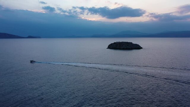 A small island in front of Vlychos Plakes Beach in Hydra Island Greece