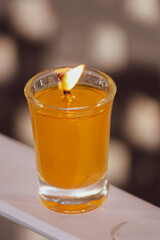A beautiful glass candle glowing
