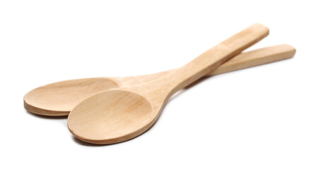 Empty wooden spoons isolated on white background
