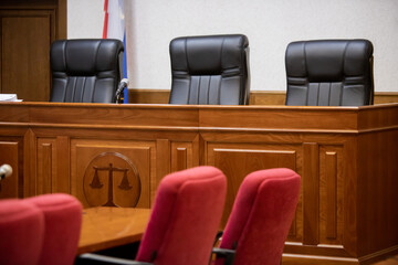 A courtroom in a Russian court, an empty judge's chair