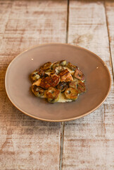 Roasted artichokes with foie served with a delicious white sauce
