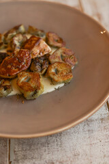 Roasted artichokes with foie served with a delicious white sauce