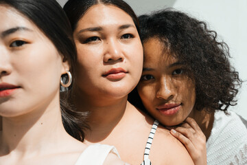 Face portraits with women of different ethnicities.