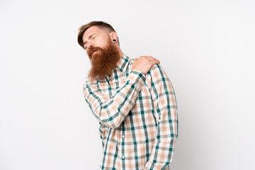 Redhead man with long beard over isolated white background suffering from pain in shoulder for having made an effort