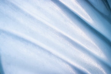 Obraz premium Blured abstract blue background and texture. It is caused by light passing through a glass.