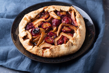 autumn galette with plums and pears. Open cottage cheese dough pie.