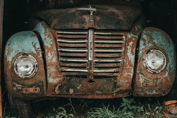 Fototapeta na wymiar Old rarity cars in a landfill. Scrap metal or vintage.