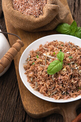 brown rice fire with small fish on wood