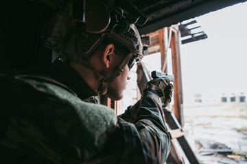 Soldier in combat. Urban combat training, soldier entering abandoned building. Anti terrorist...