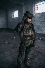 Military men with arms defending the building. Soldier stand guard securing territory looking around.