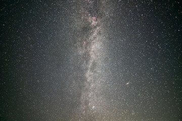 Black night stars covered sky with bright Milky Way galaxy.