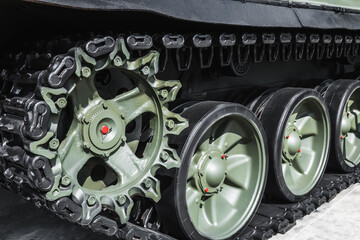 rollers and wheels on the tracks of the suspension of the battle tank