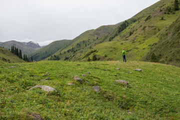 Fototapeta na wymiar A man standing in a mountain valley