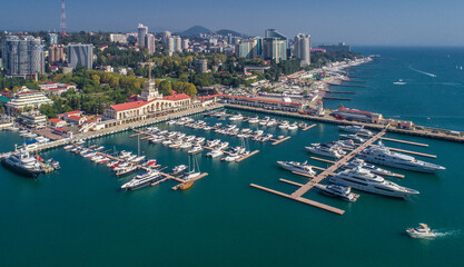 Obraz premium Aerial photography. The black sea coast of Russia, the city of Sochi, seaport, yachts and ships at the pier. City attraction