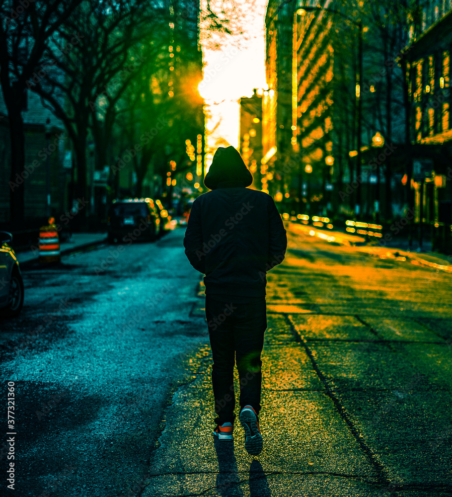 Wall mural person walking on the street