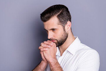 Profile side photo of minded pensive guy wait job vacancy decisions touch fist together chin look copyspace wear white trendy shirt isolated over gray color background