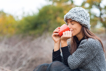 girl with a cup of tea in winter