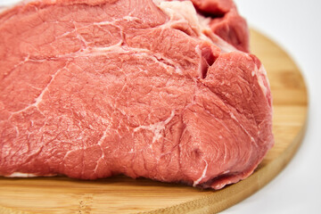 A piece of fresh raw meat pulp on a white background, isolated. The concept of cooking dishes from fresh meat, beef, bones, the best restaurant, delicious cuisine