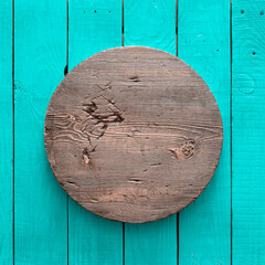 Fototapeta premium round wooden plate on old wooden background